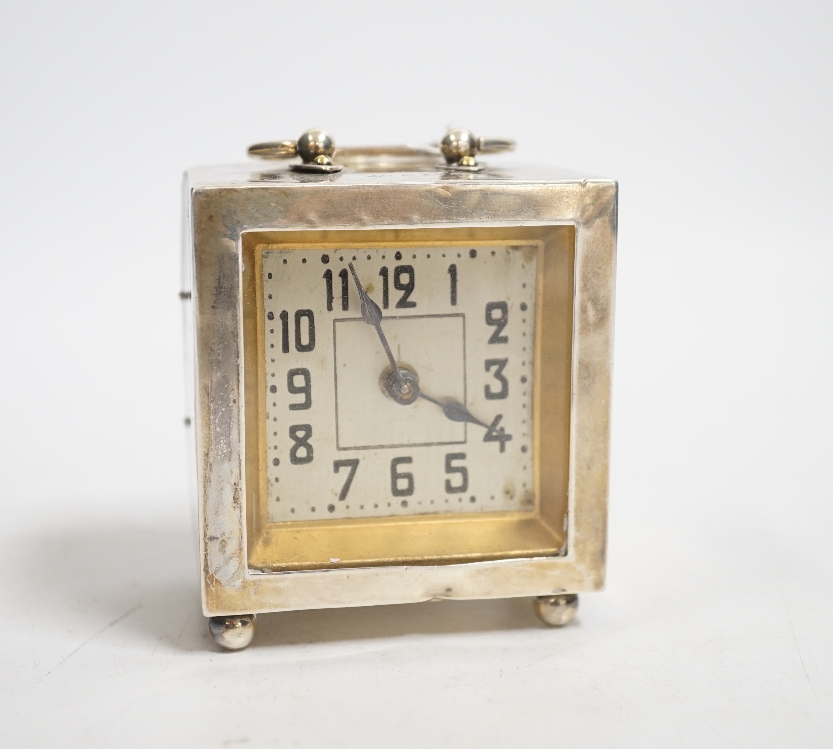 A George V silver rectangular carriage timepiece, with Arabic dial, maker LH, Birmingham, 1912, 72mm excluding handle.